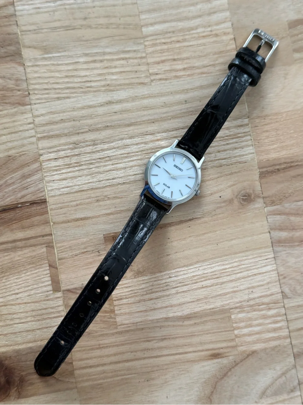 Seiko Solar Ladies Watch White Round Dial Black Leather Strap Stainless Case